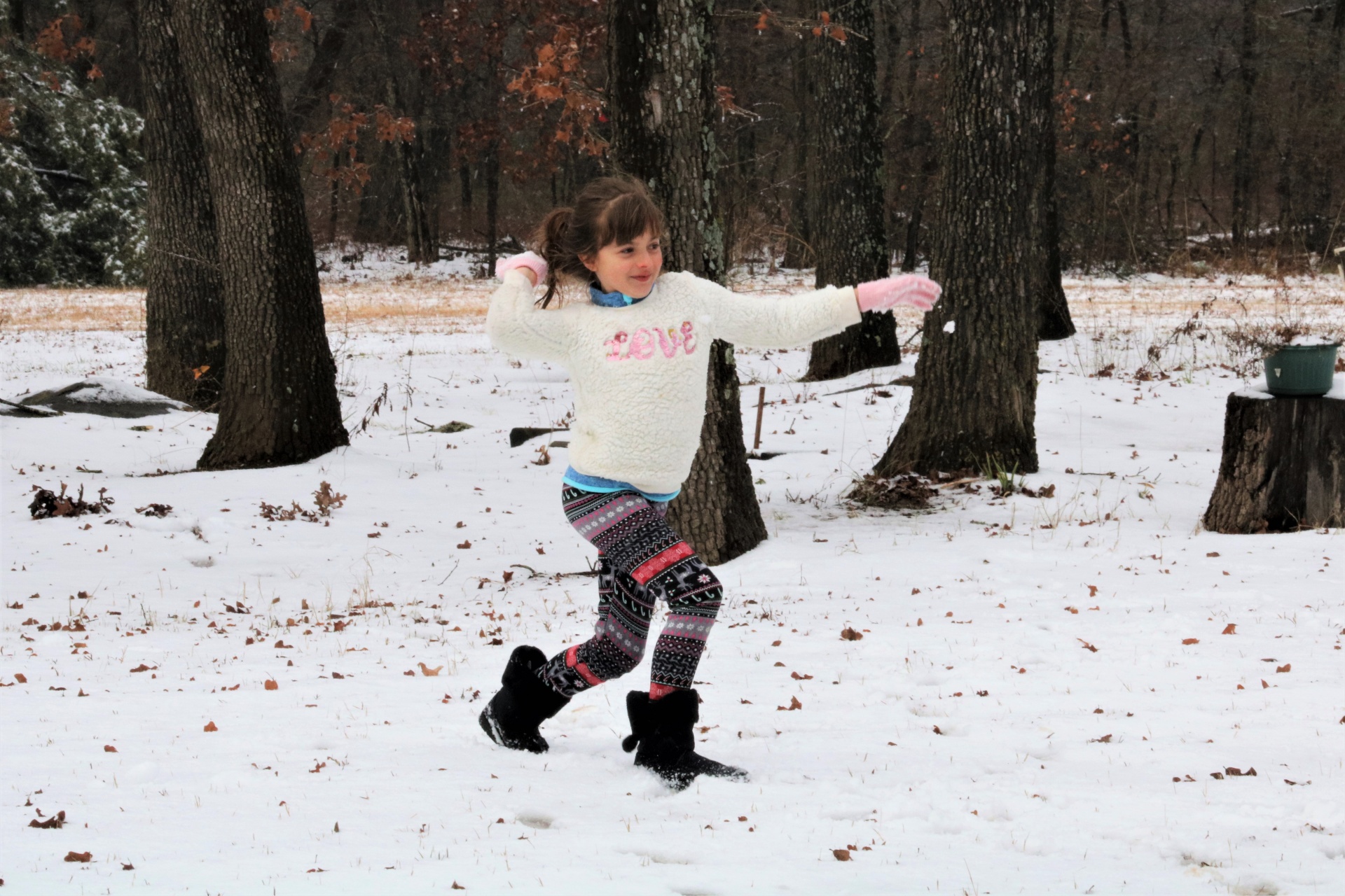 Young Girl Throwing Snowball