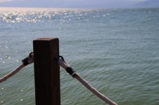 Post On Pier Against Water