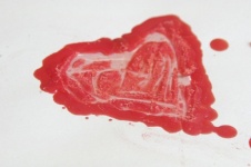 Wax Red Heart Shape On White