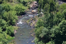 Aerial View Of A River With Rocks