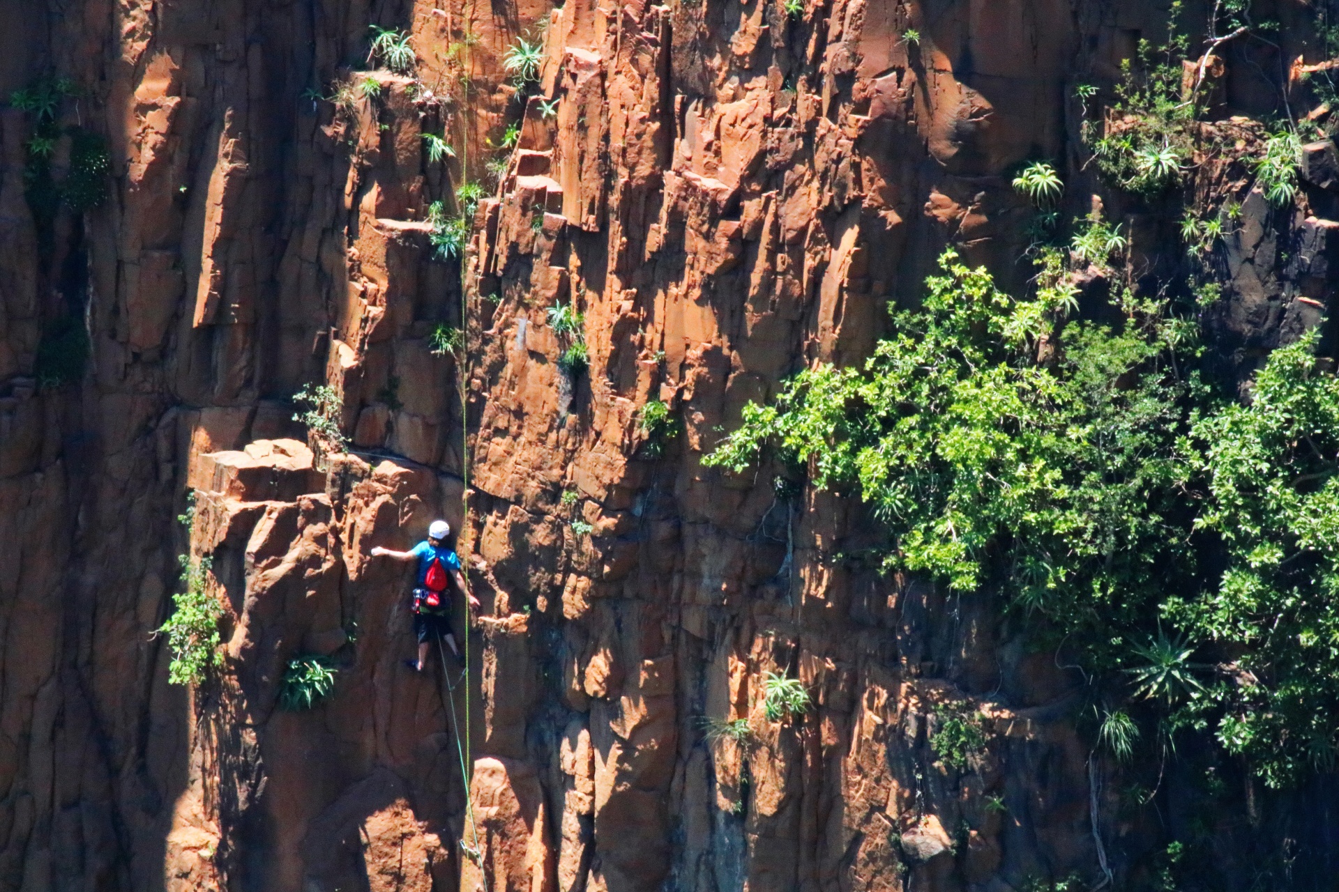Mountain Climber Against A Cliff