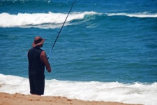 Fisherman On A Beach