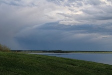 Storm Clouds Over A Lake