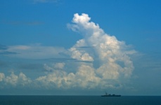 Towering White Cloud Over Ocean