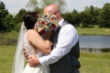 Wedding Couple Hiding Kiss