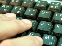 Worker Typing On The Keyboard