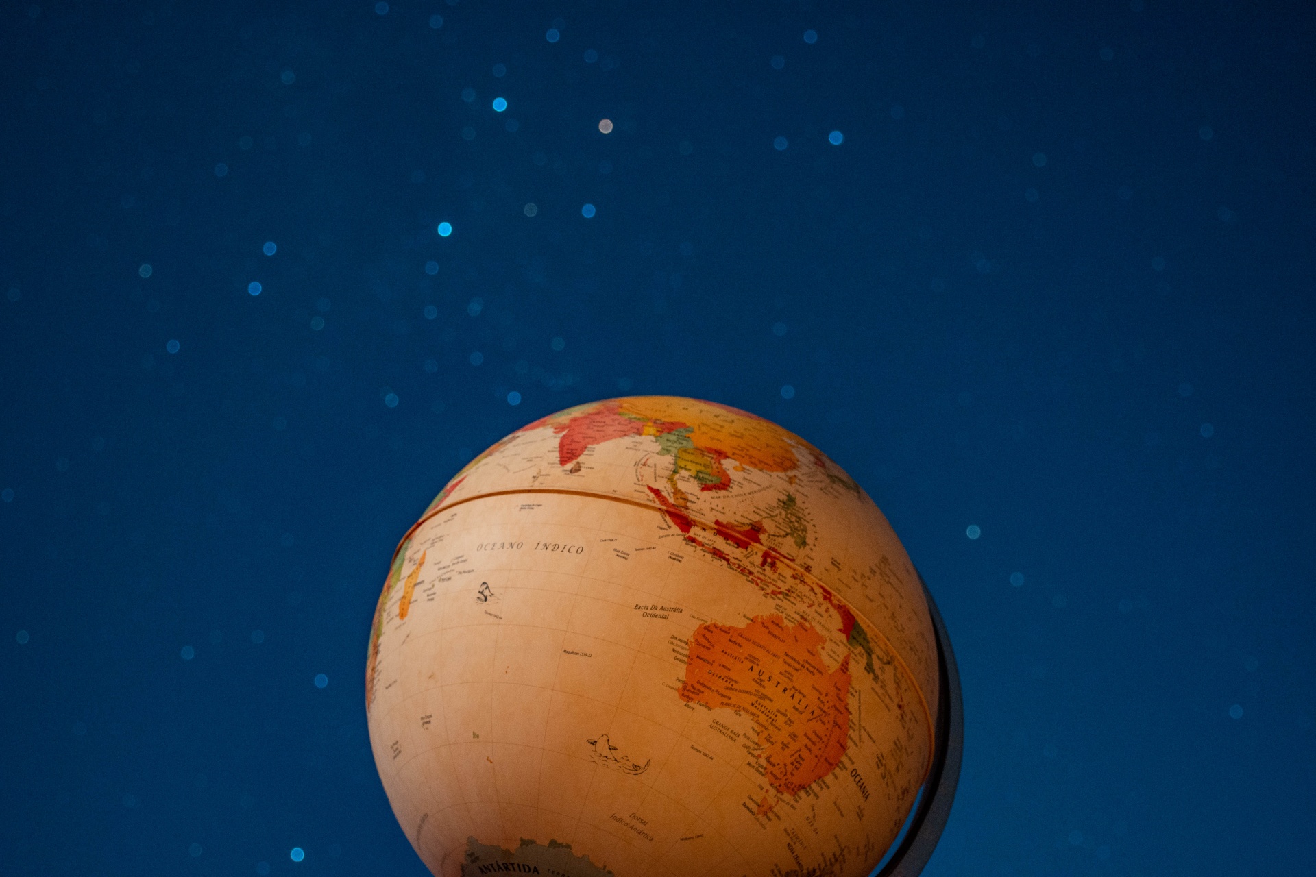terrestrial globe focusing on australia with long exposure at night