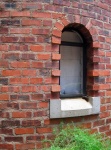 Arched Window In A Brick Tower