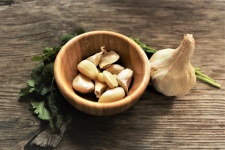 Cloves Of Garlic In Wood Bowl