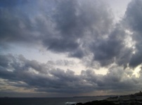 Dark Grey Clouds Over The Ocean