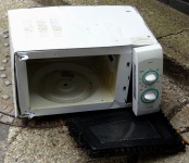 Discarded Faulty Microwave Oven