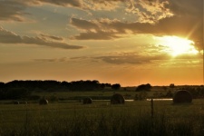 Golden Sunset Over Hay Field