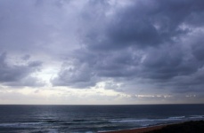 Low Dark Clouds Over The Sea