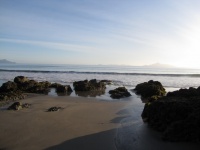 Sand Rocks And Sea