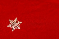 Silver Snowflake On Red Table