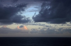 Soft Sunset Clouds At Dusk Over Sea