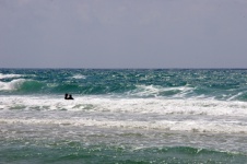 Swimmers In Stormy Sea
