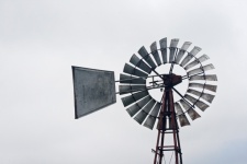 View Of Windmill Wheel Against Grey