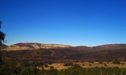 View Over Of Hills With Burnt Grass