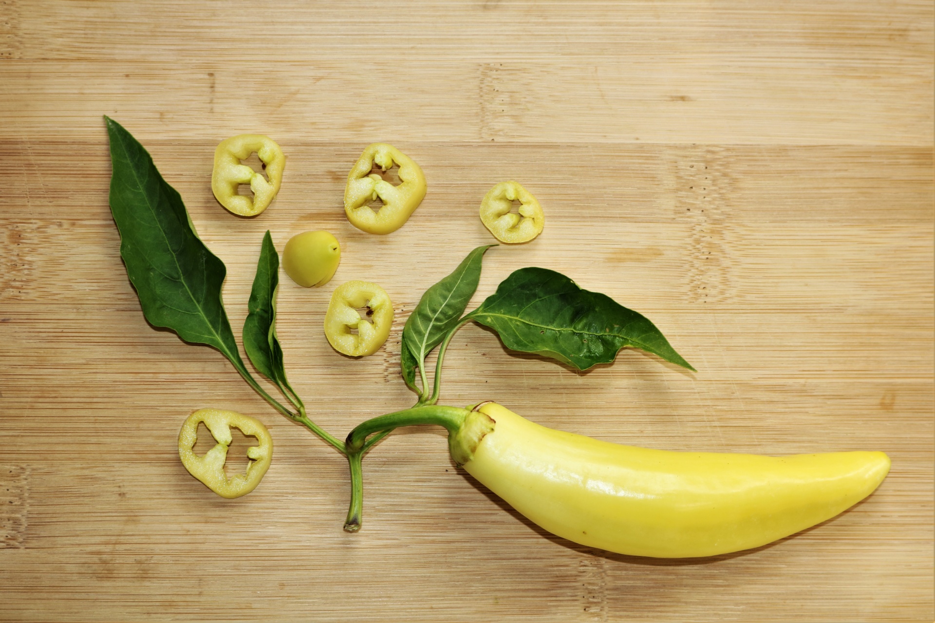 Banana Pepper And Slices On Wood