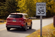 Car And A Speed Limit Sign