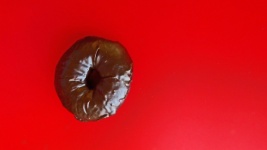 Chocolate Donut On Red
