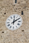 Clock Face On A Stone Wall