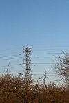 Tall Electrical Pilon In Landscape