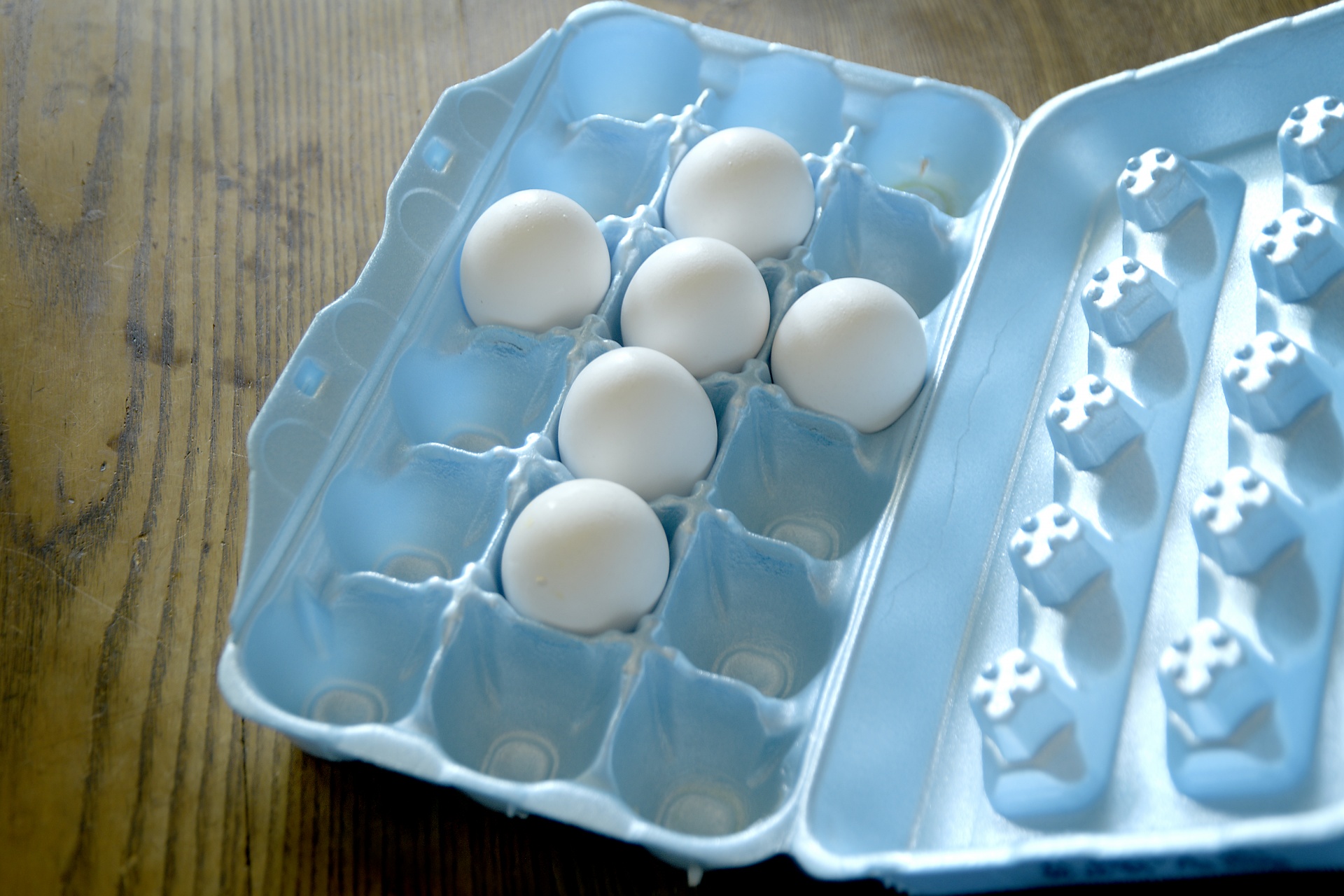 Eggs in an egg carton in the shape of a cross