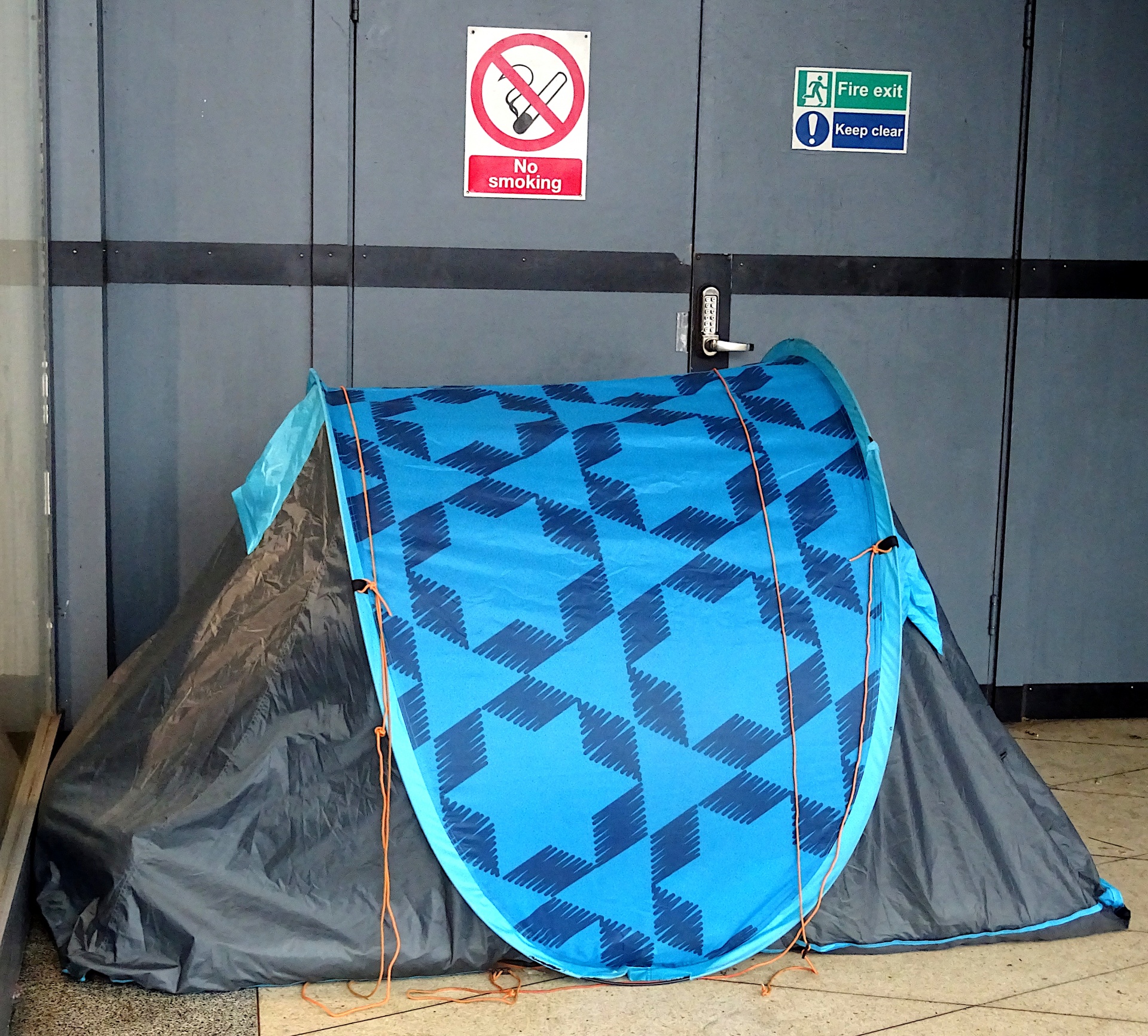 Homeless People In Tent In Doorway