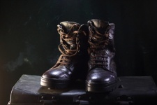 A Pair Of Old Leather Combat Boots
