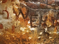 Graffiti And Engravings On Old Wall
