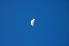 Half Moon Against Blue Sky