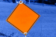 Orange Caution Road Sign