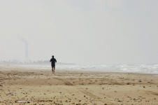 Man Running On Winter Beach