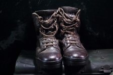 Pair Of Old Combat Boots On Trunk