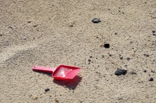 Red Plastic Spade Forgot On Beach