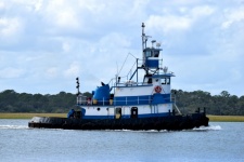 Tugboat Cruising On The River
