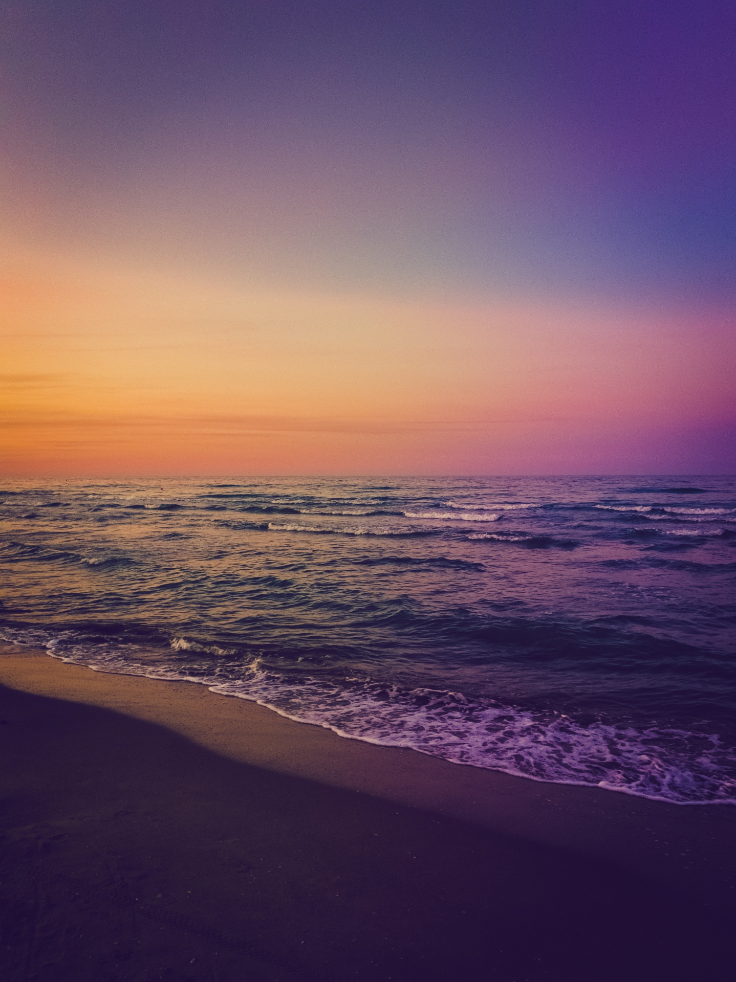 Colorful purple orange blue beach sunset