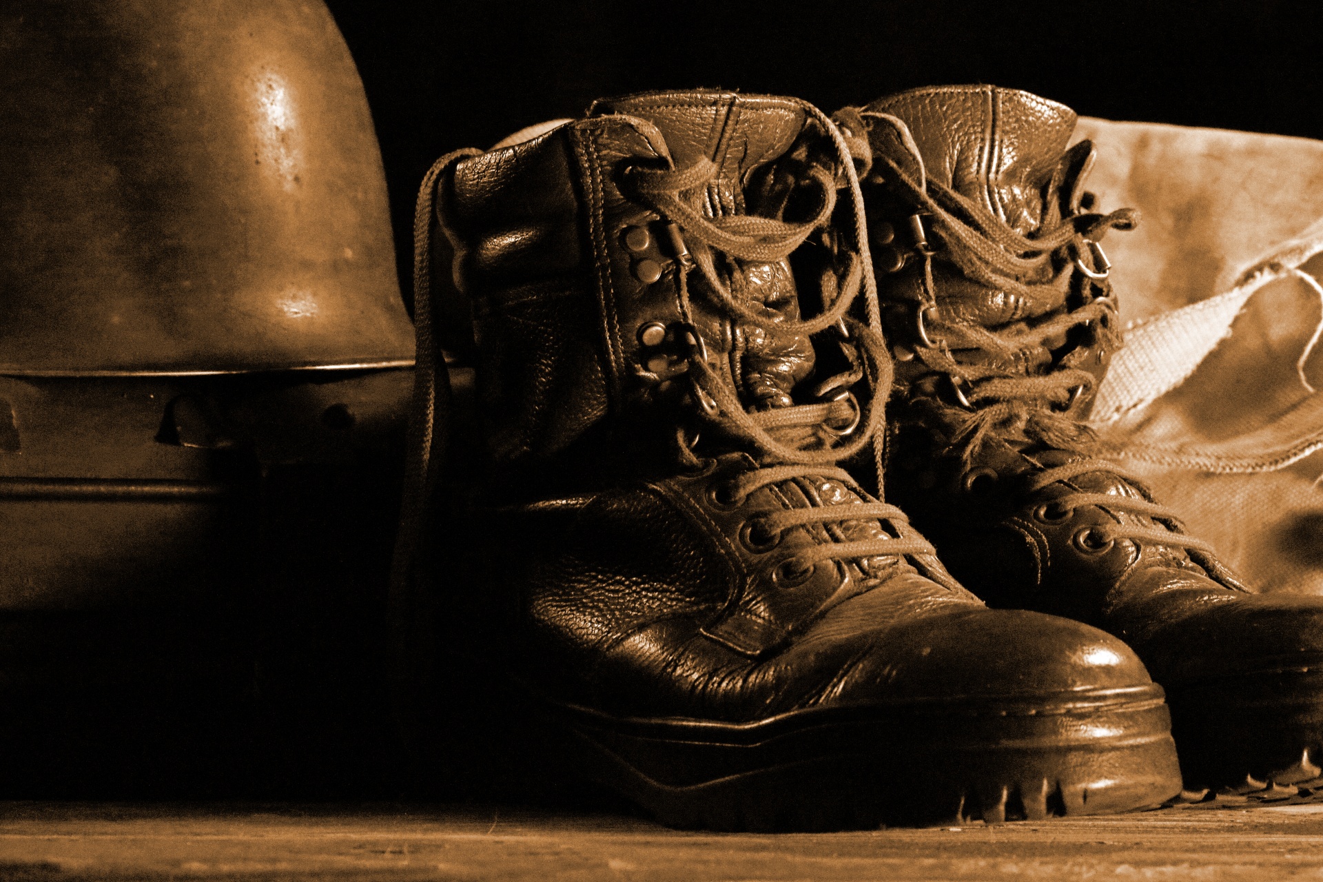 Combat Boots And Helmet In Sepia