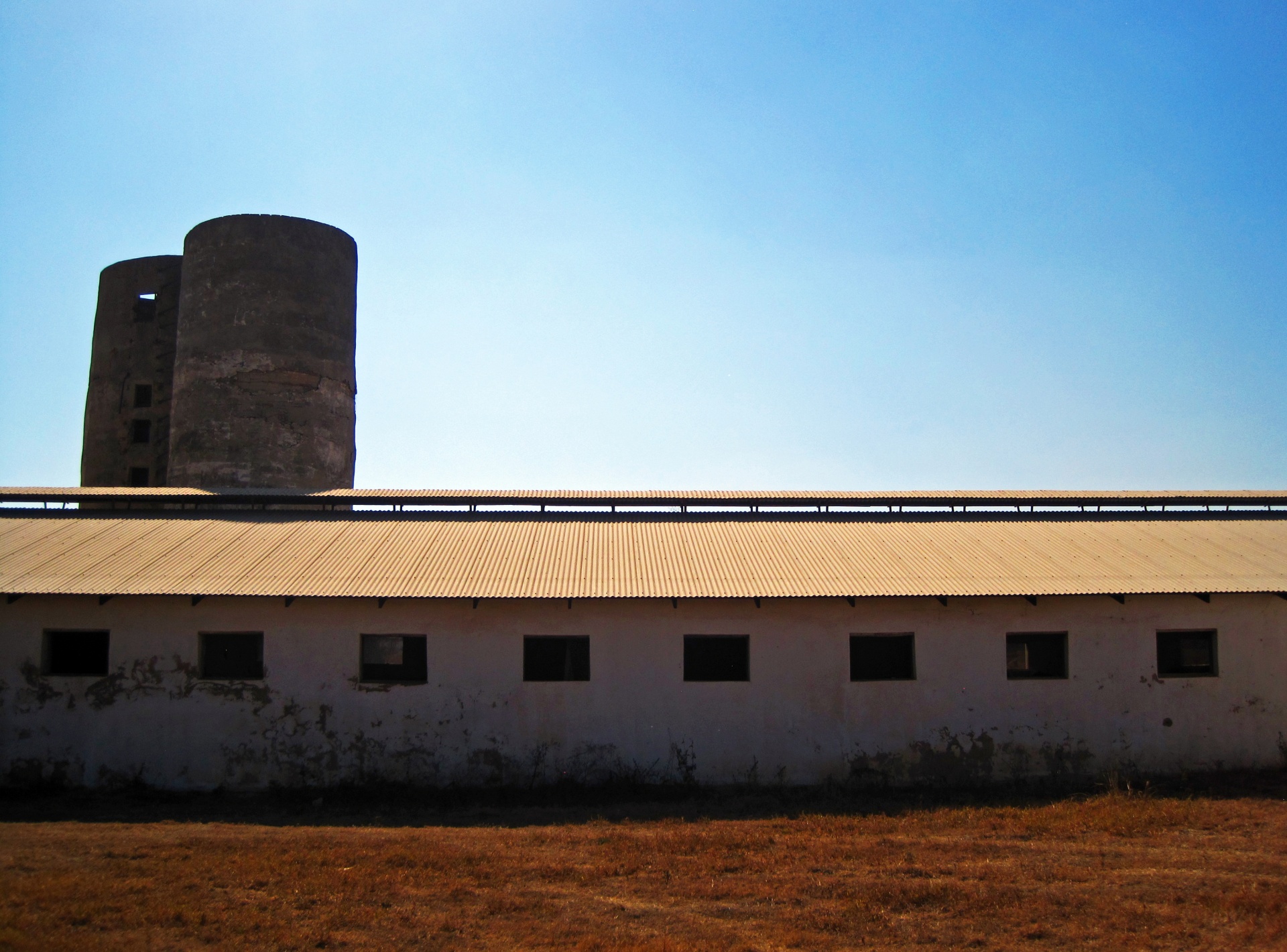 Farm Outbuilding With Two Old Silos