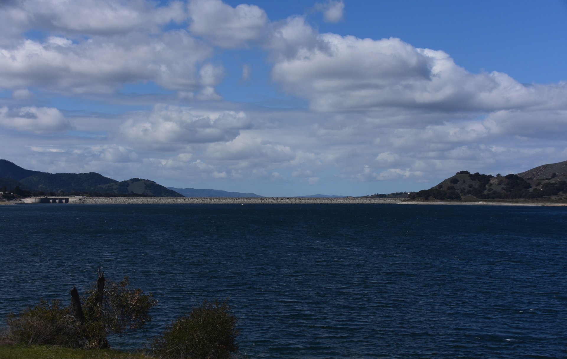 bradbury dam visible across the large lake reservoir of Lake Cachuma