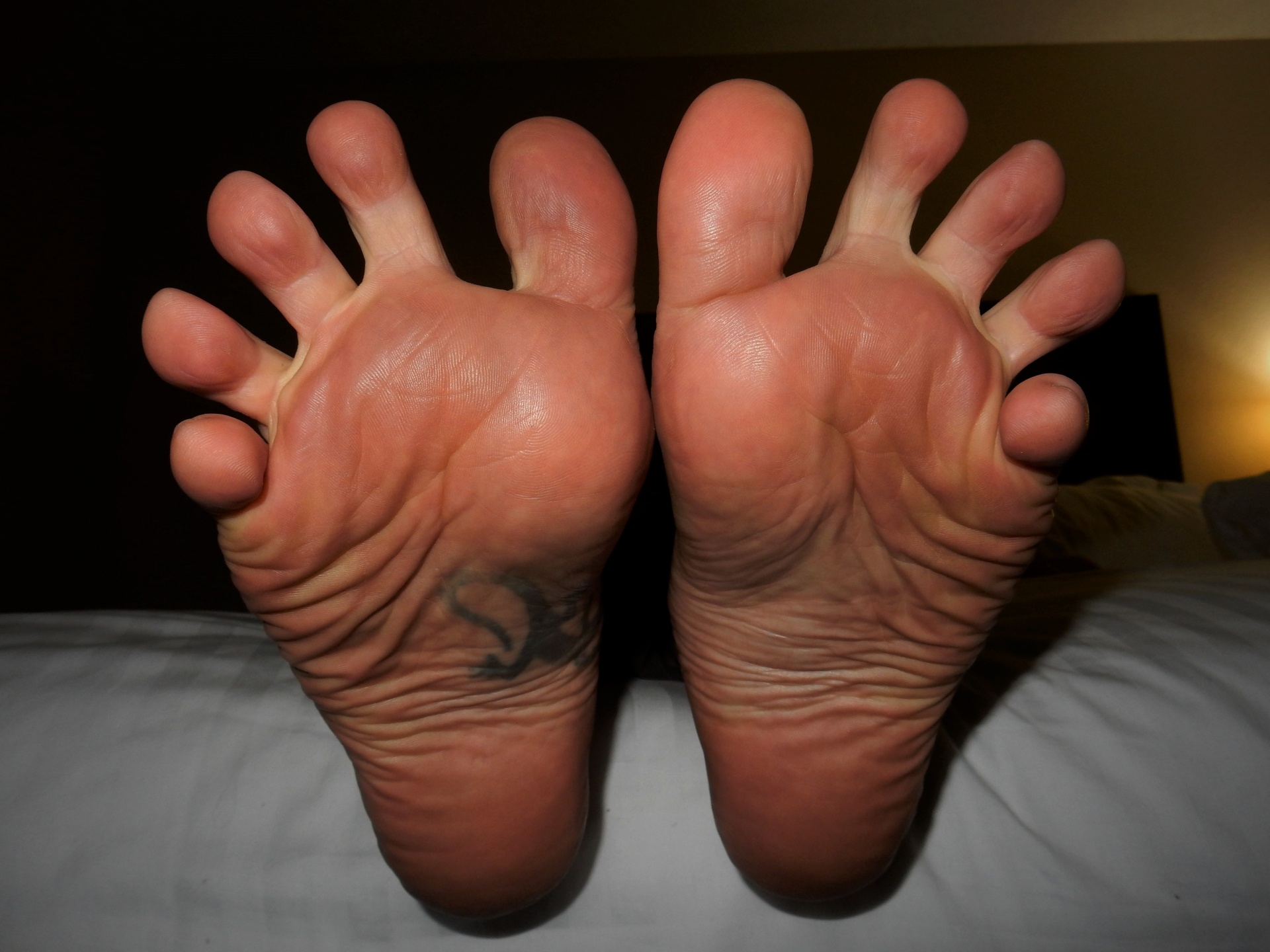 barefoot male spreading his toes