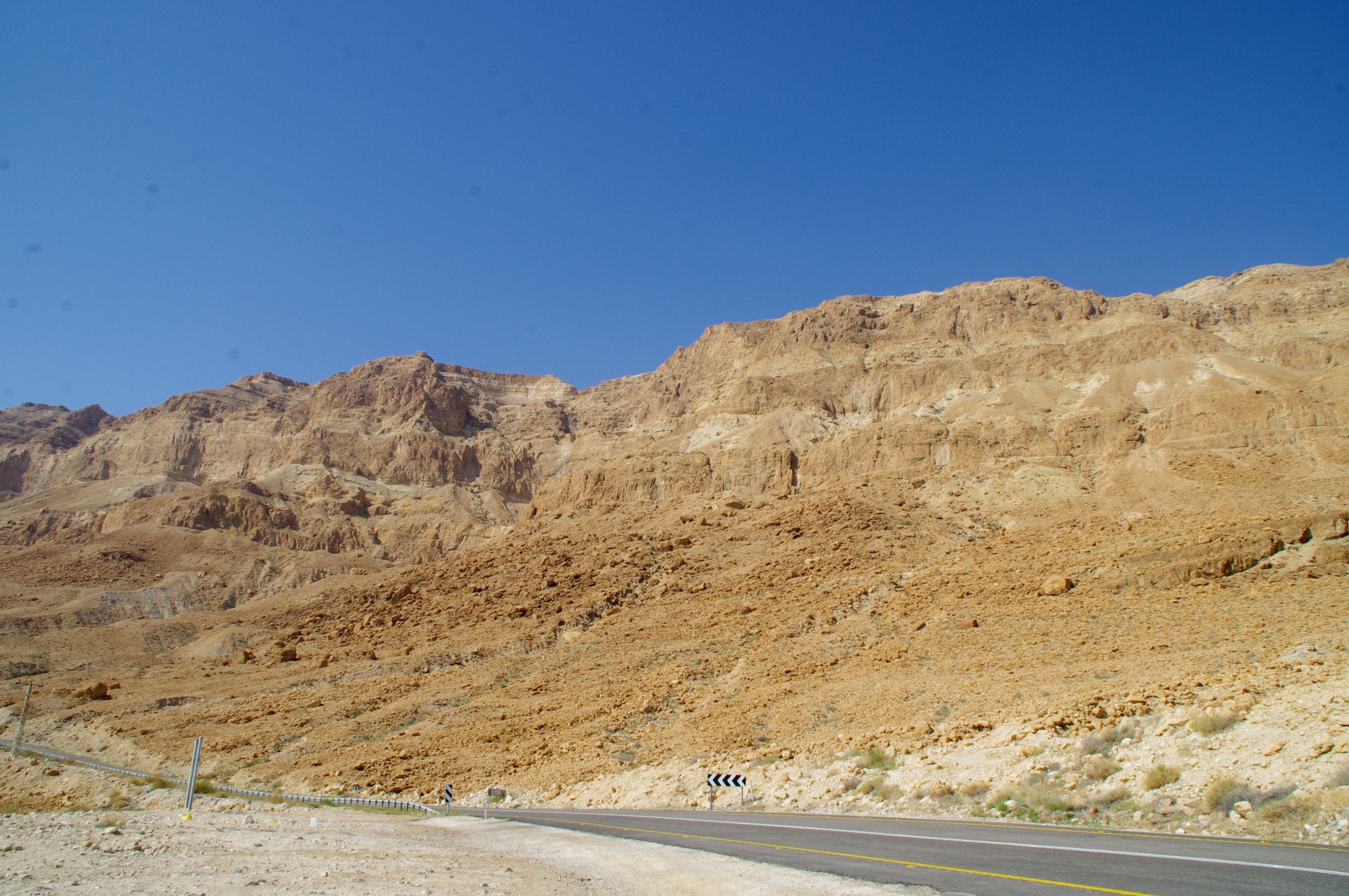 Small road along desert mountain range in Israel
