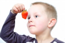 Child And Strawberries