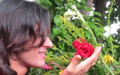 Model Touching Red Rose
