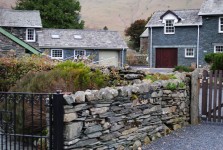 Stone Wall And Farmhouse