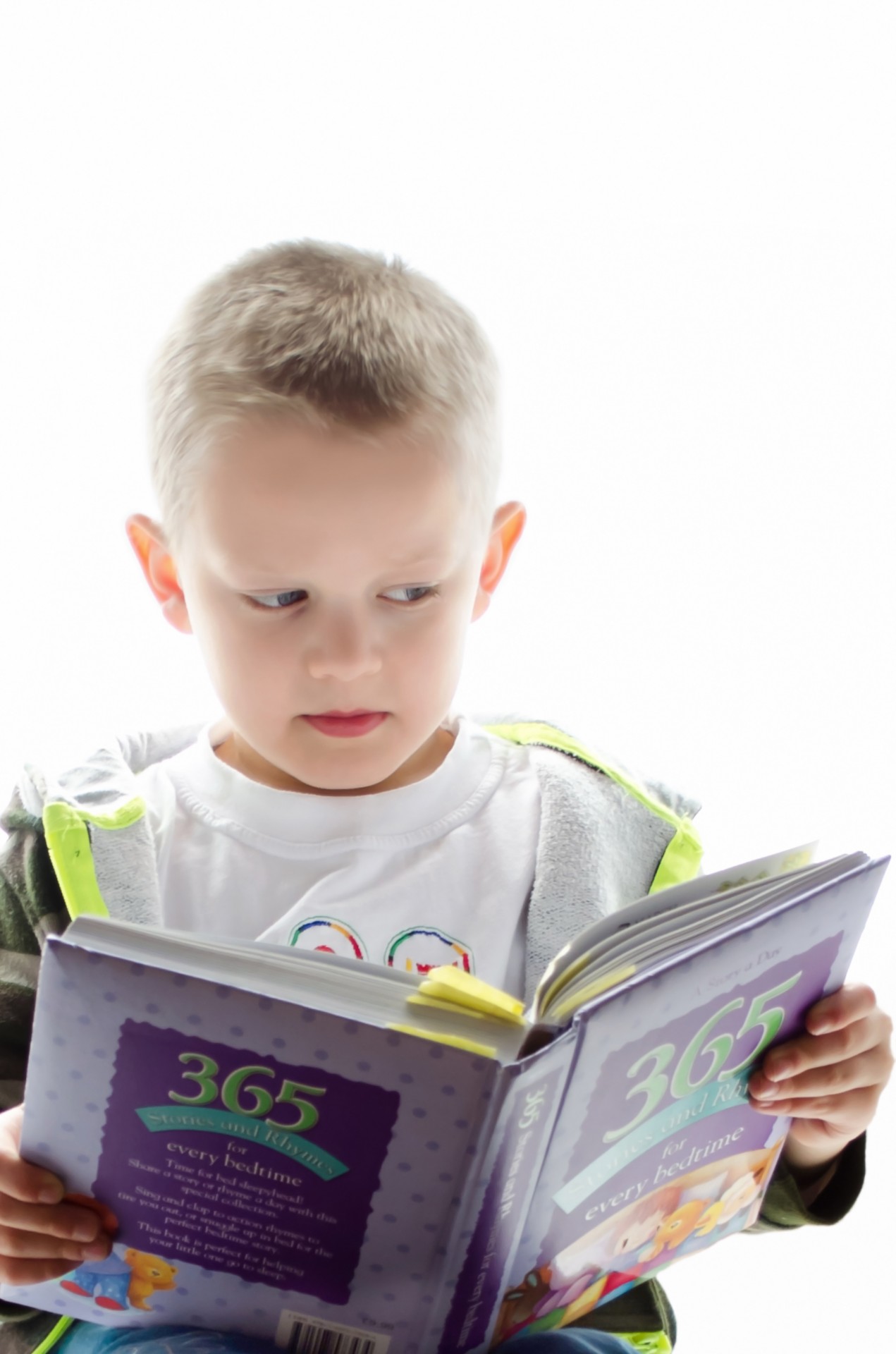 Child and Book On The White Background