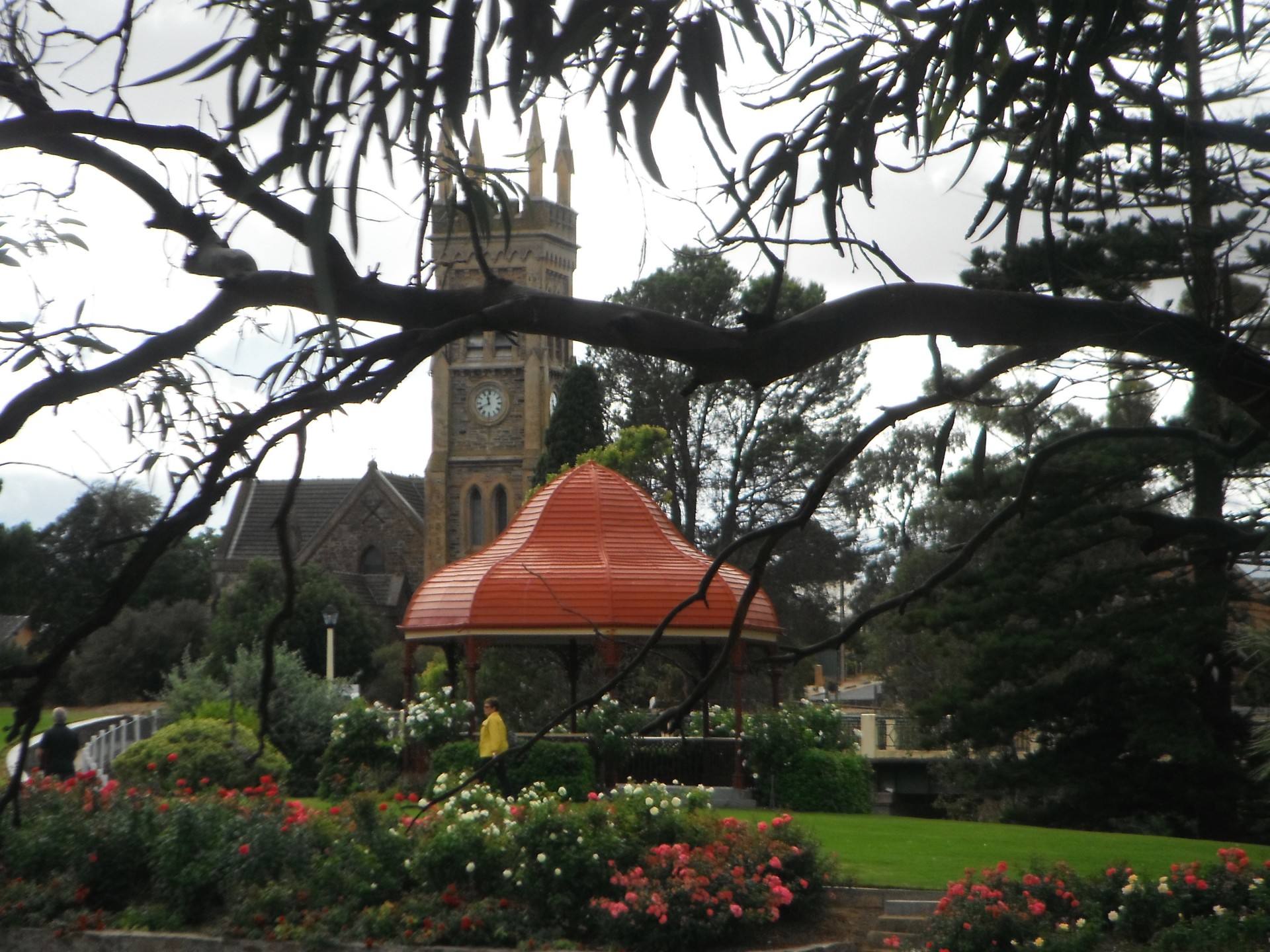 A gazebo in parkland with a church in the background gives an English feel.