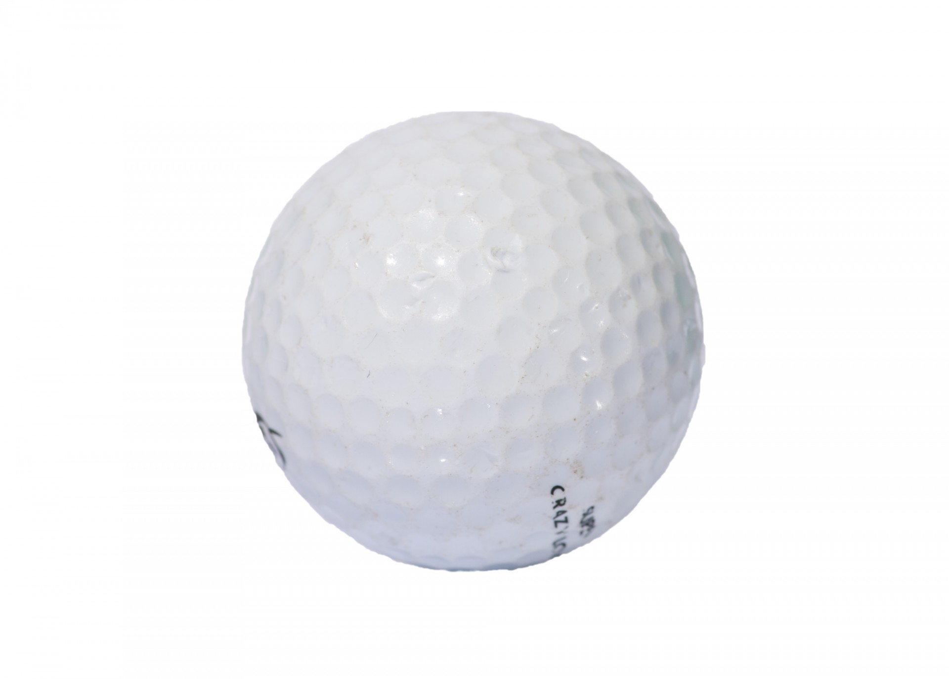 Close-up of a used golf ball on white background